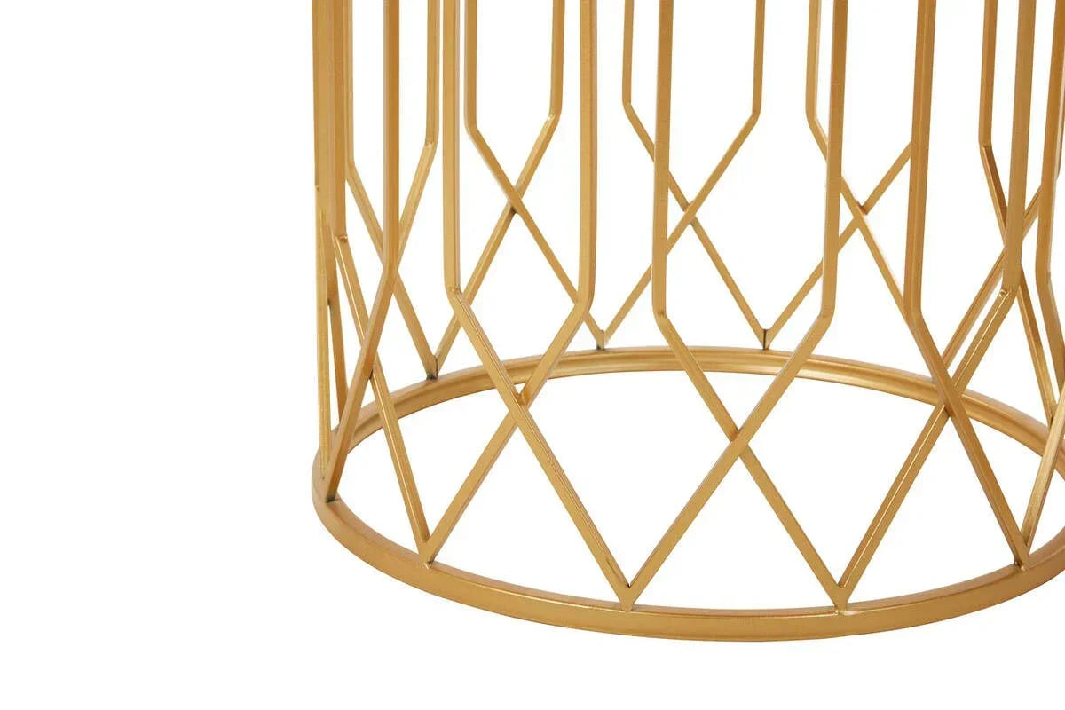 Gold metal coffee table base with geometric lattice design, close up view