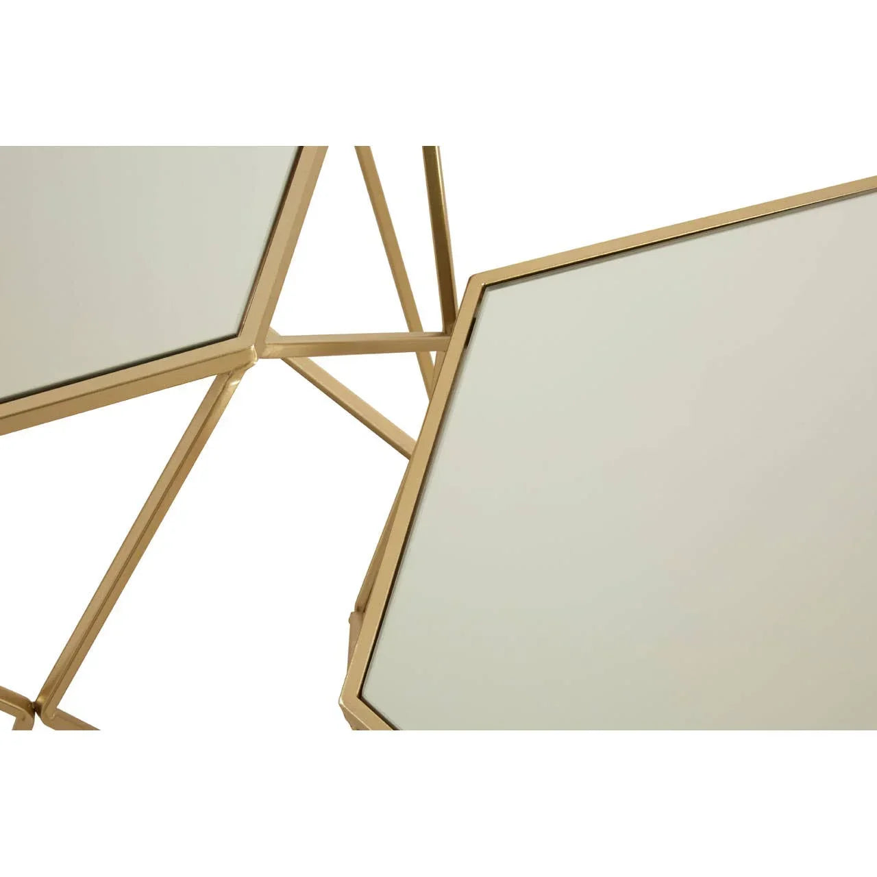 Geometric glass coffee table with gold metal frame, angled top detail view