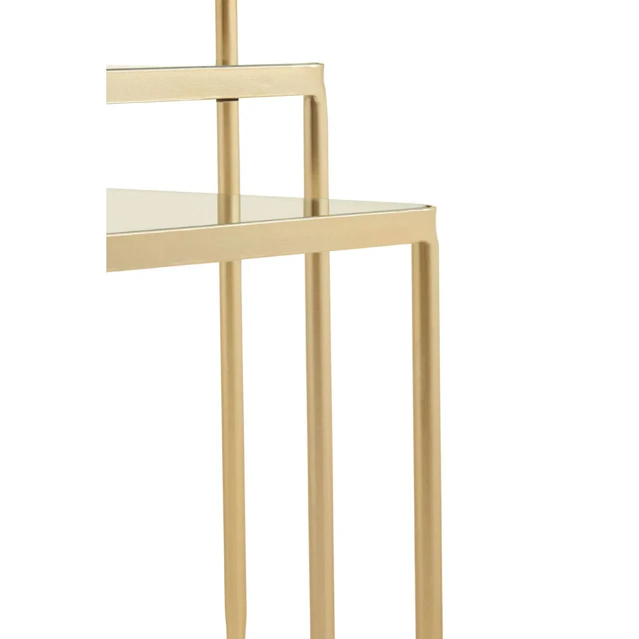 Closeup of nested glass tables with gold metal legs and clean modern lines