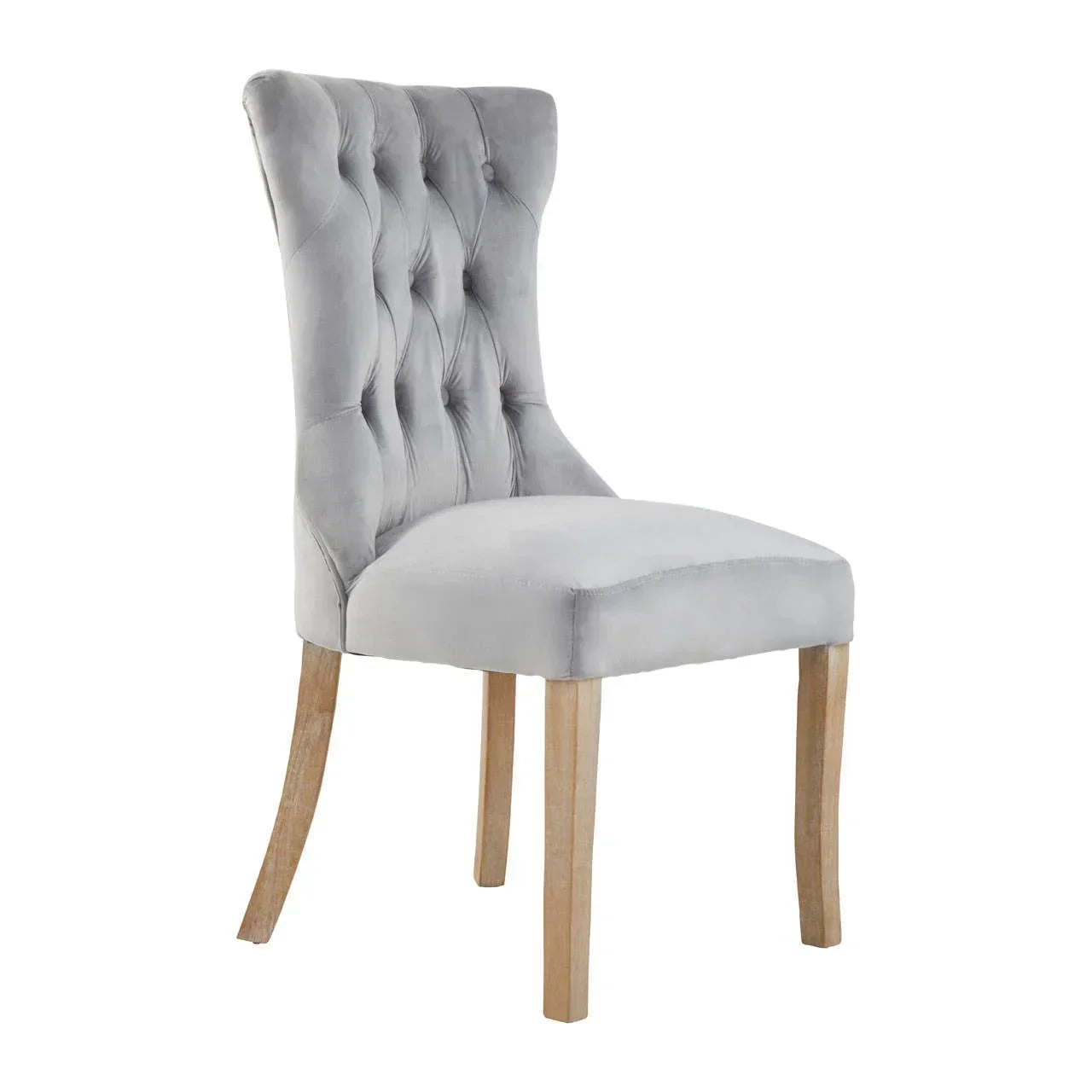Grey velvet dining chair with button-tufted back and light wood legs