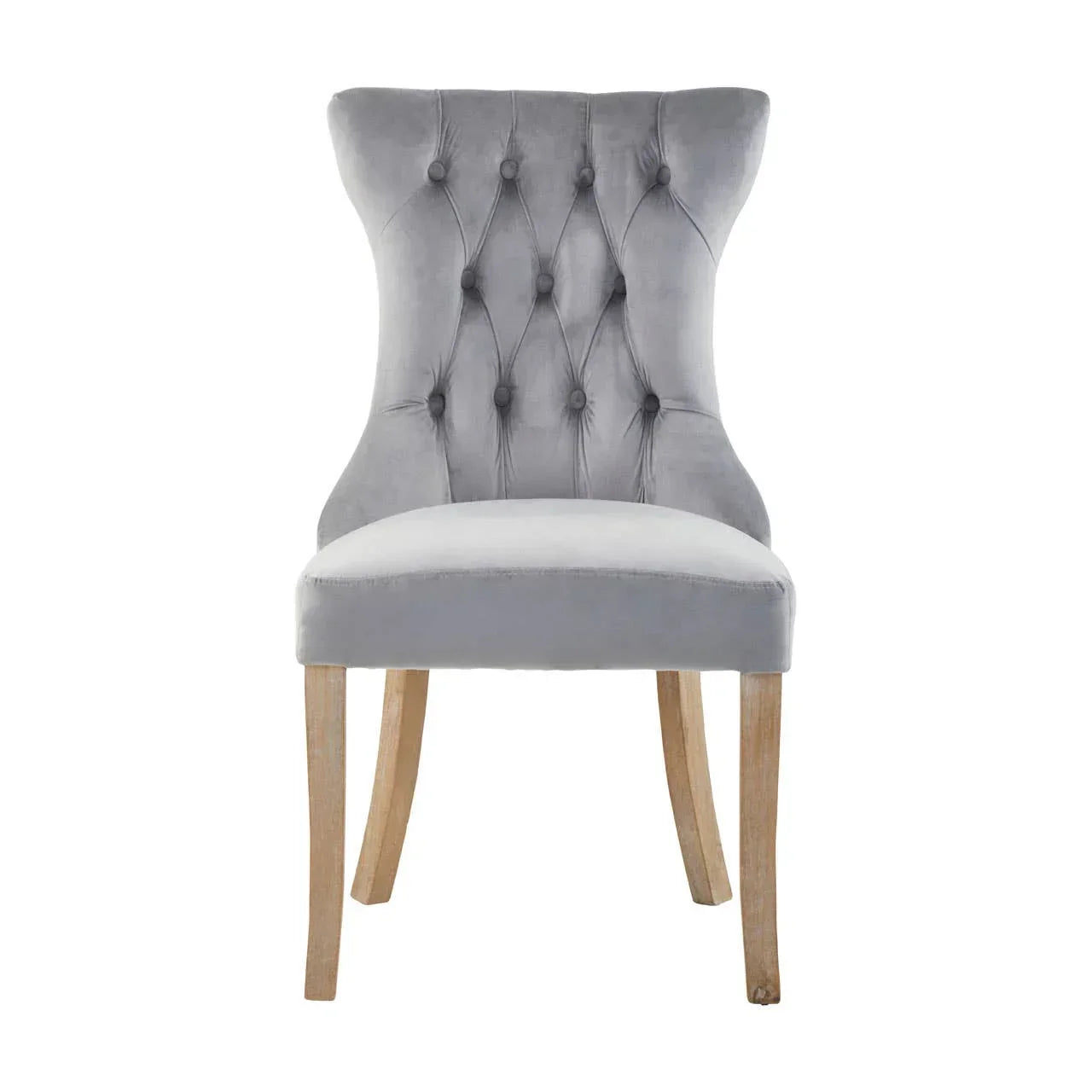 Grey velvet dining chair with tufted back and wooden legs, front view