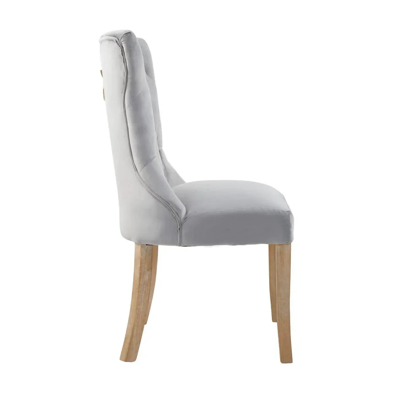 Grey upholstered dining chair with natural wood legs, side view
