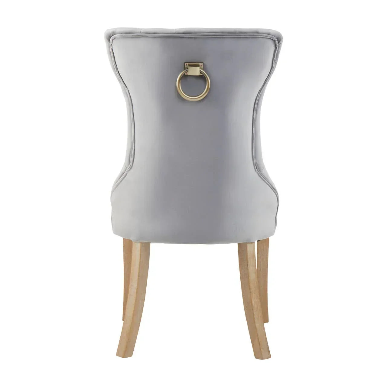 Grey velvet dining chair with ring handle and light wood legs, rear view