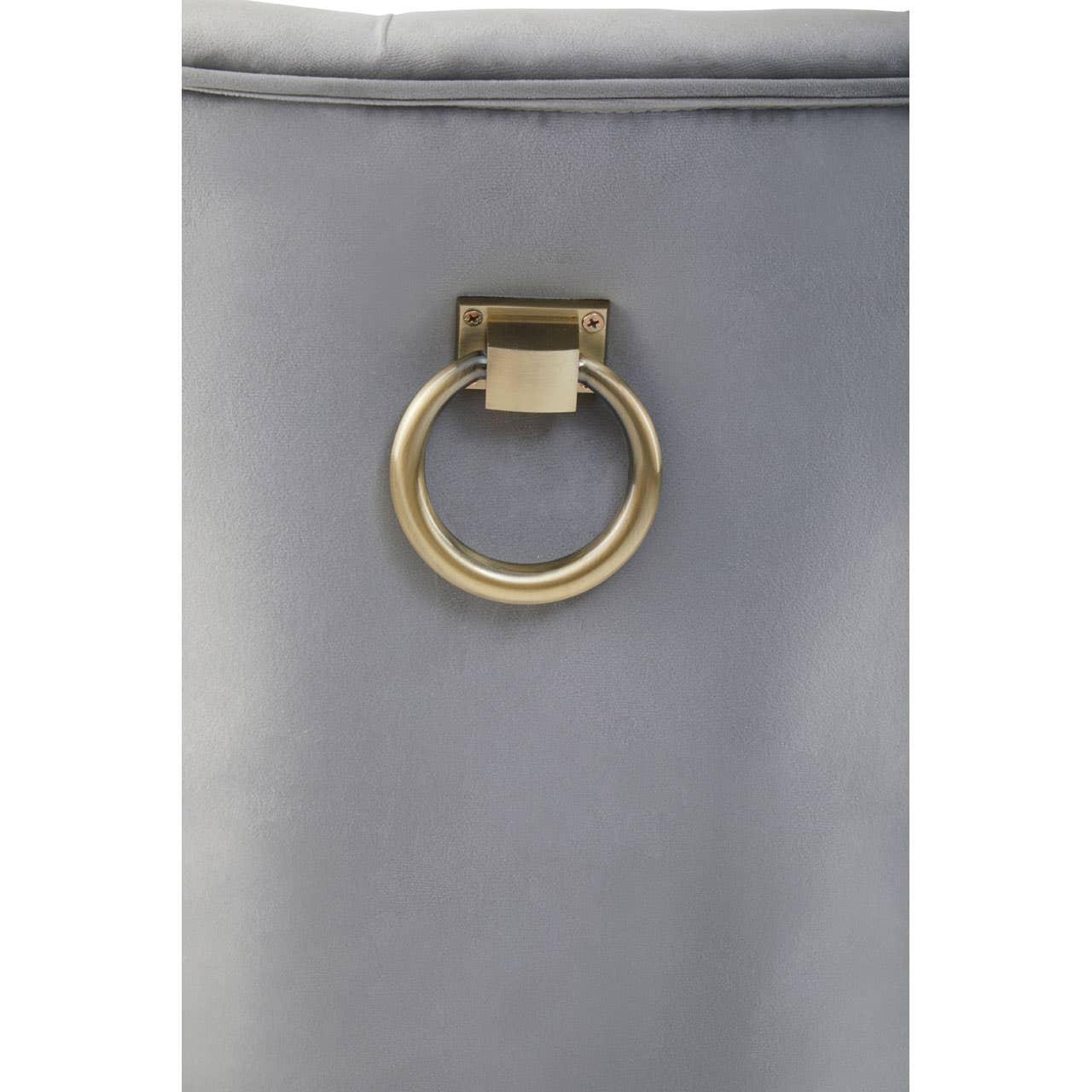 Grey velvet chair back with gold metal ring handle detail
