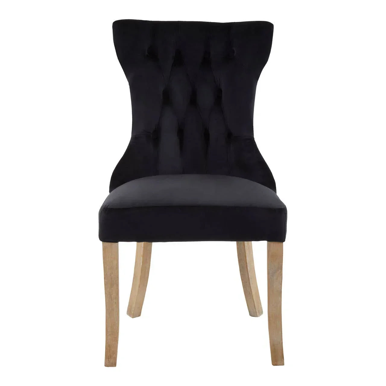 Black velvet dining chair with tufted backrest and light wood legs, front view