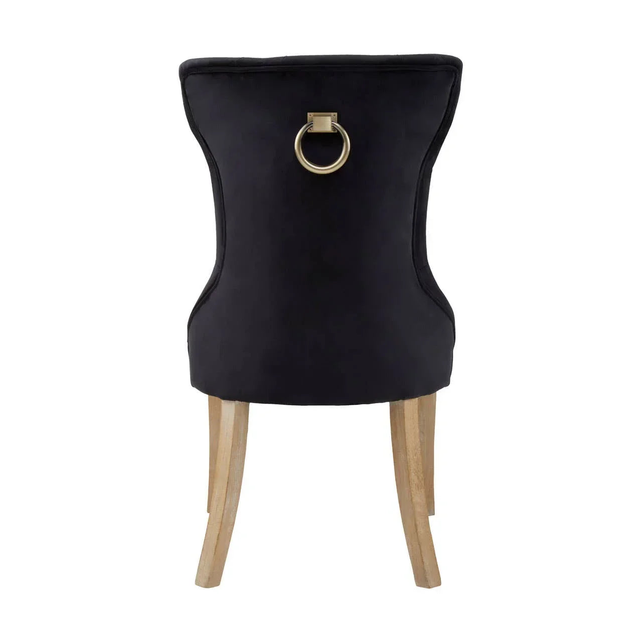 Black velvet dining chair with gold knocker detail and light wood legs, rear view