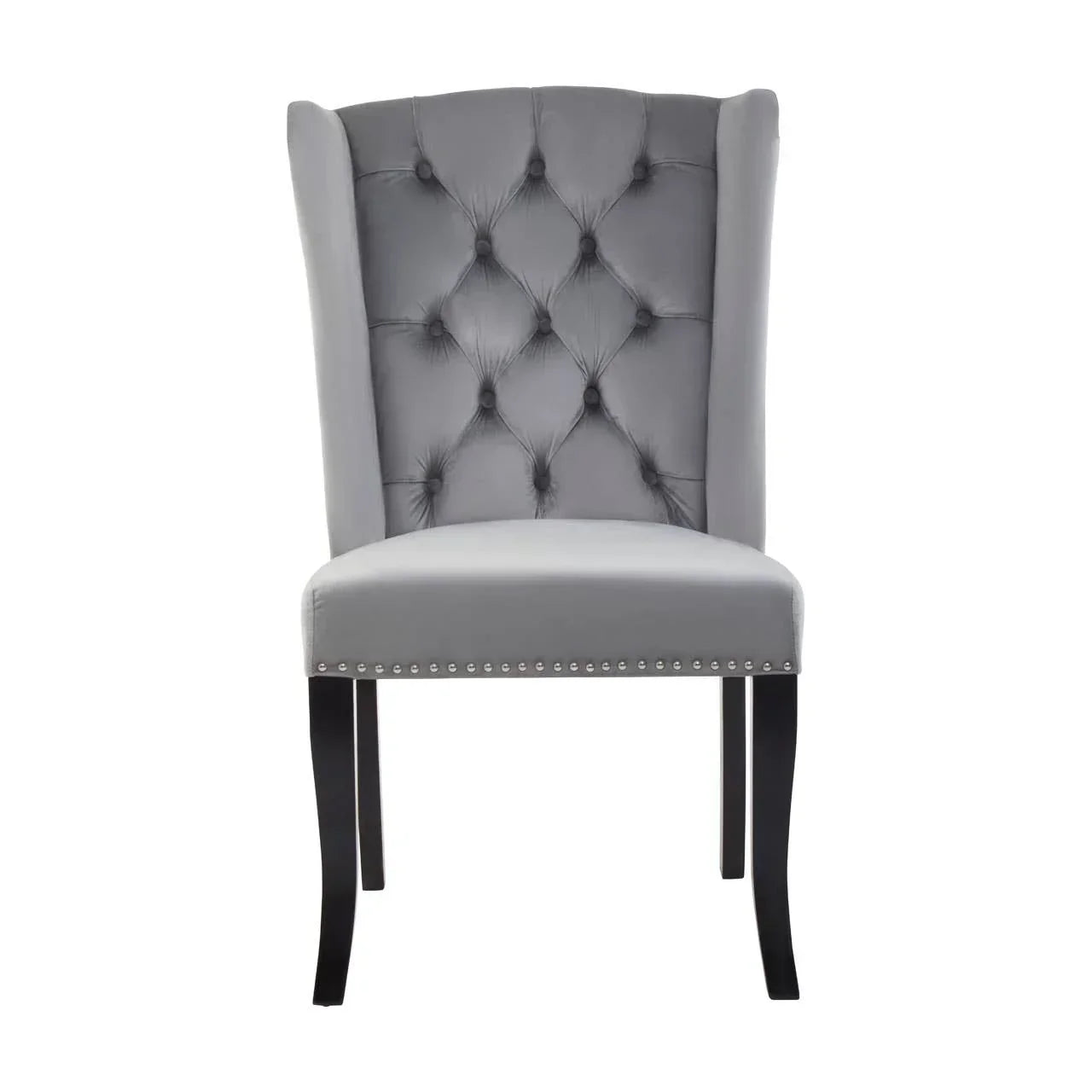 Grey velvet dining chair with tufted backrest and silver stud trim, front view