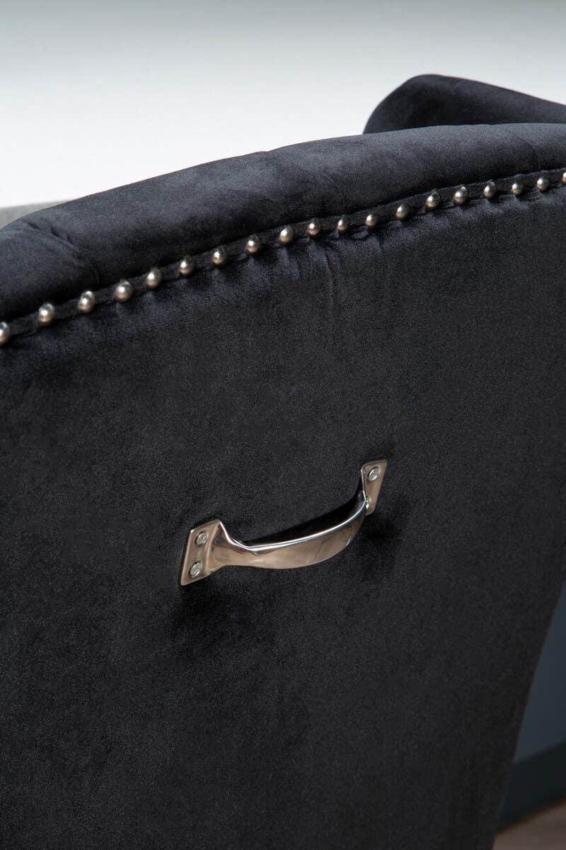 Black velvet dining chair back with chrome handle and silver stud detailing