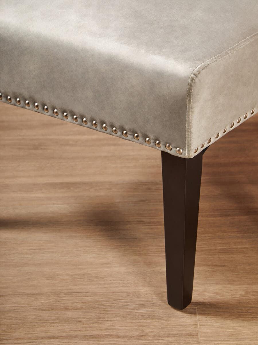 upholstered dining bench grey faux leather seat with studded trim and dark wood leg