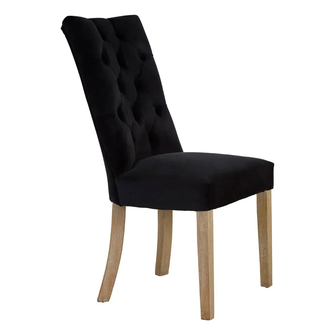 Black velvet dining chair with button-tufted backrest and light wood legs, side angle