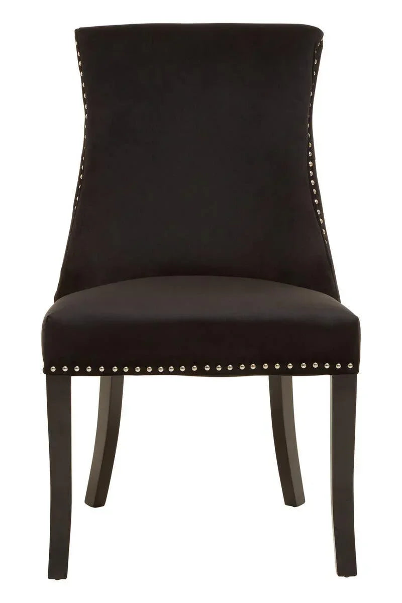 Black velvet dining chair with silver stud detailing and wooden legs, front view