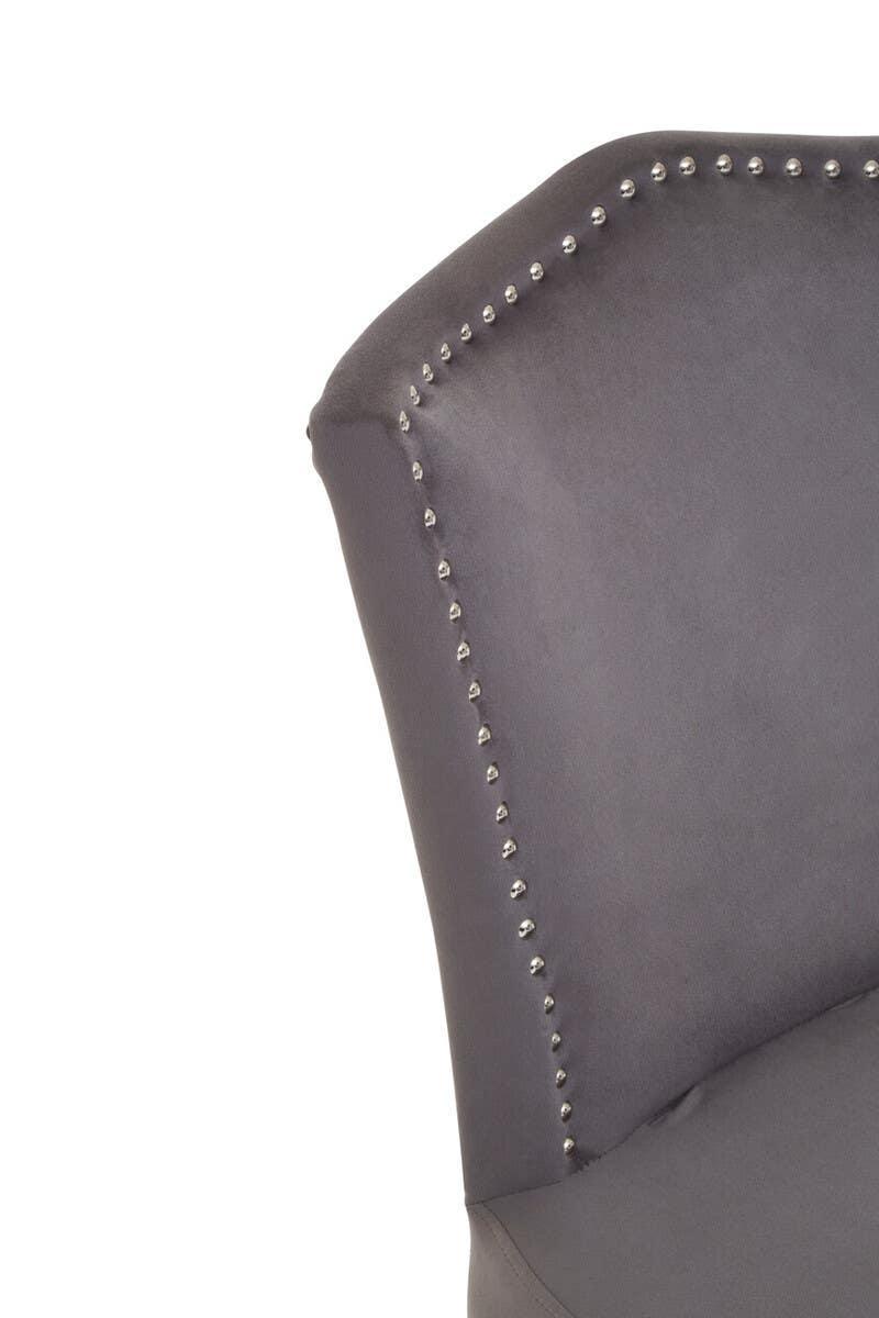 Grey upholstered chair backrest with silver stud detailing