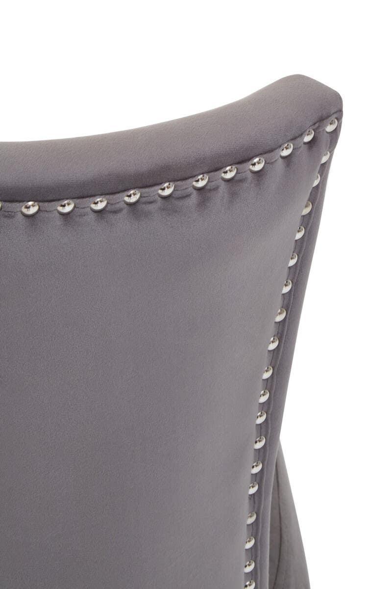 Grey velvet dining chair backrest with silver stud trim detail