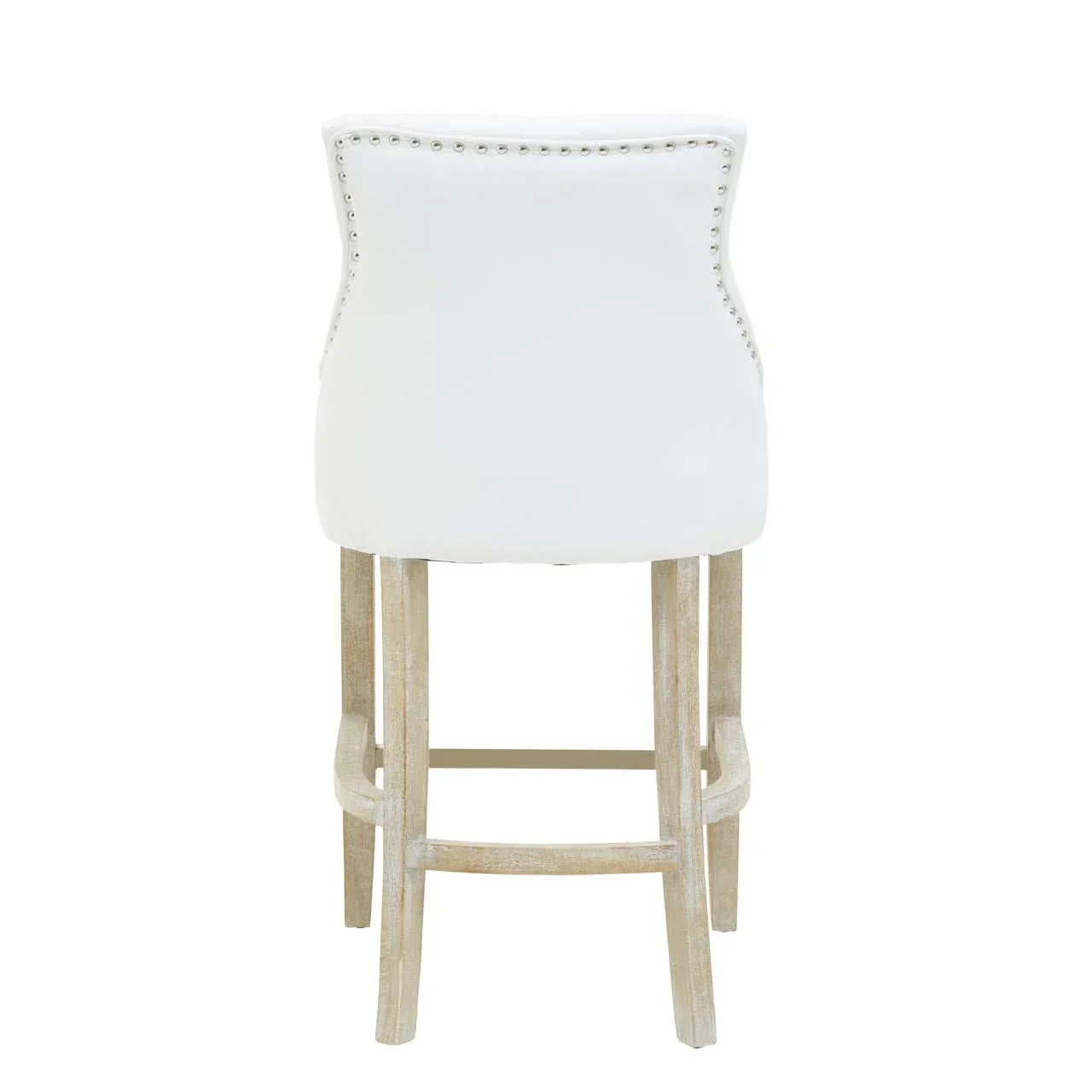 White upholstered bar stool with nailhead trim and light wood legs, rear view