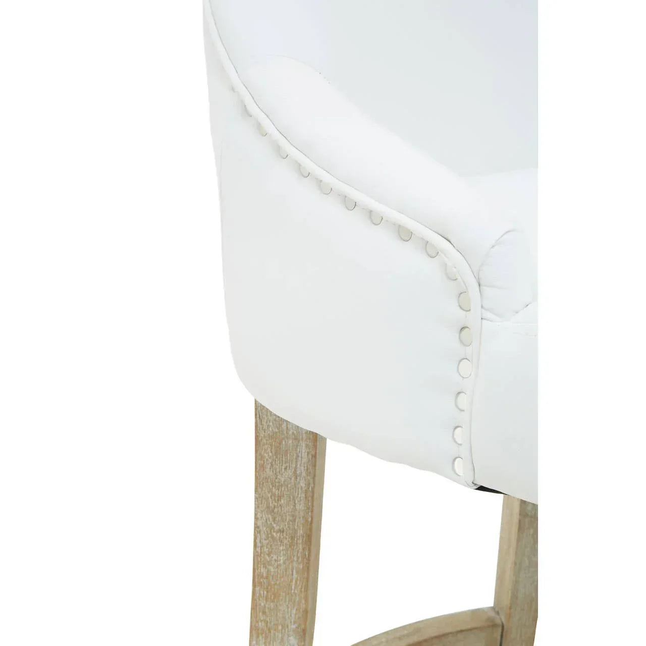 White upholstered bar stool with nailhead trim and light wood legs, close-up view