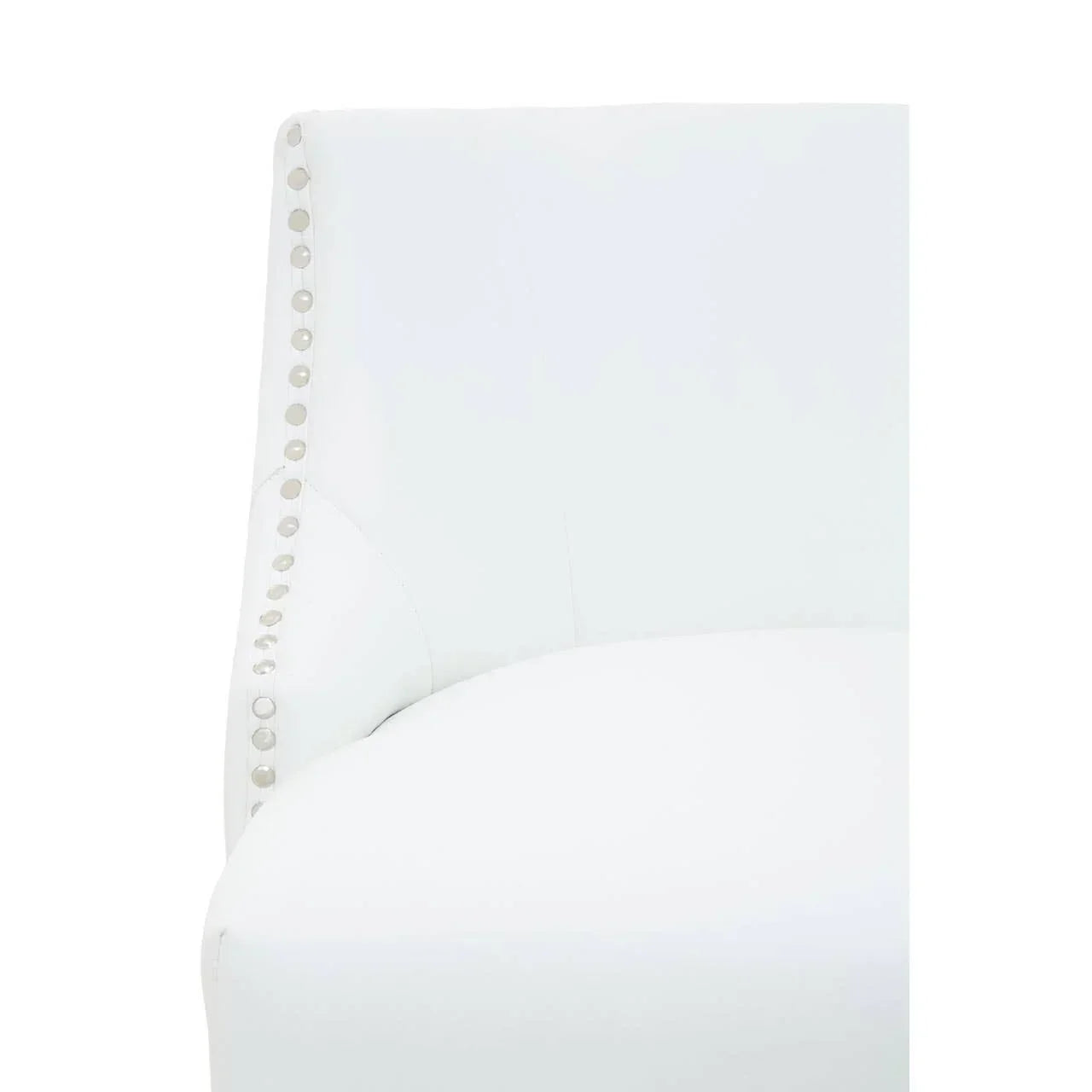 White accent chair with silver studded trim on curved backrest, close-up angle