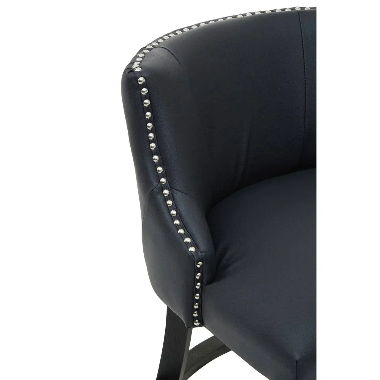 Black leather dining chair with curved back and silver studded trim