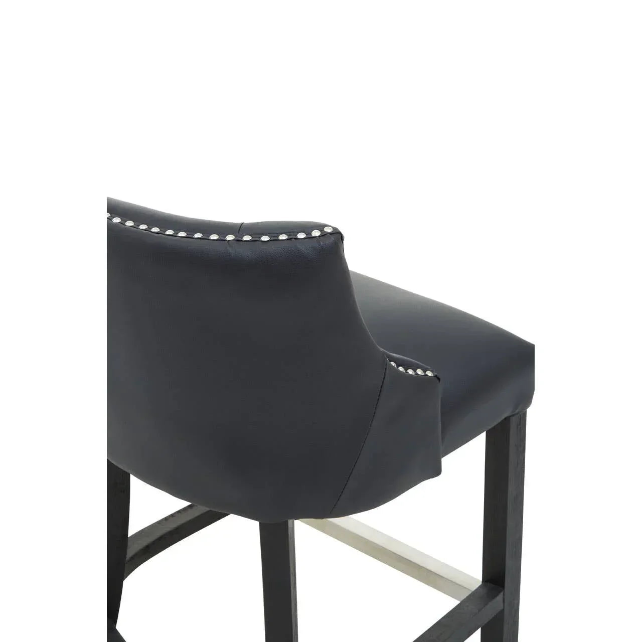 Black leather bar stool with silver stud detailing and wooden legs, rear angle view