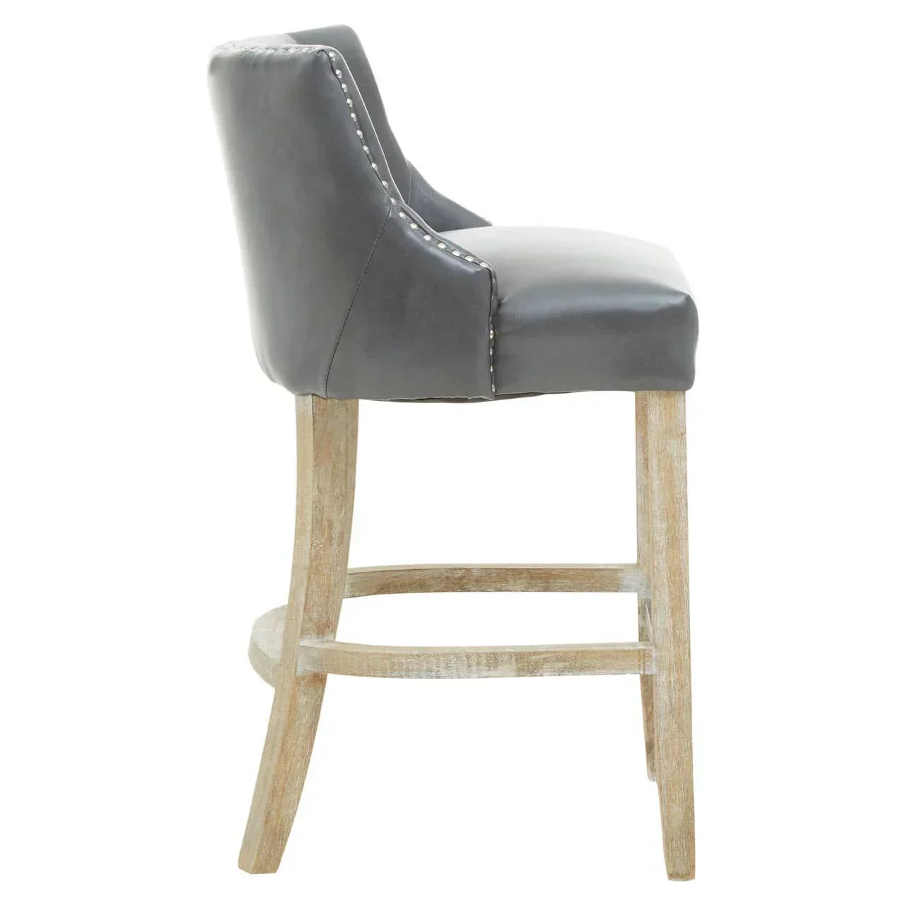 Side view of grey leather bar stool with wooden legs and nailhead trim