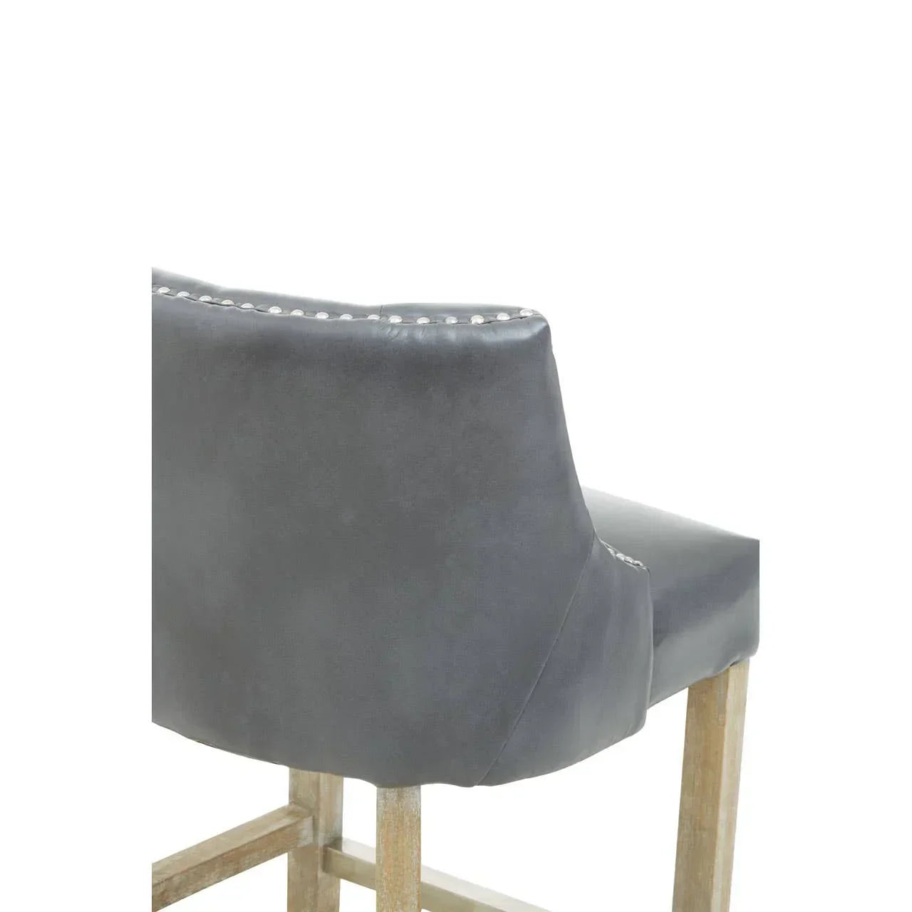 Grey leather bar stool with wooden legs and silver stud detailing on backrest