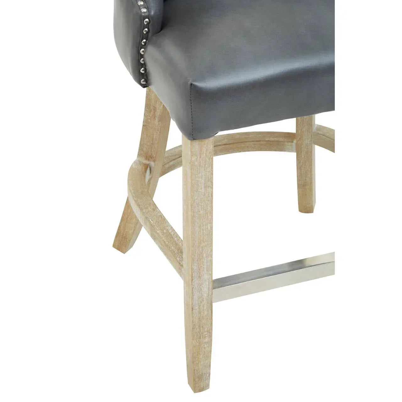 Grey leather bar stool with studded trim and light wood legs, close-up on seat and base