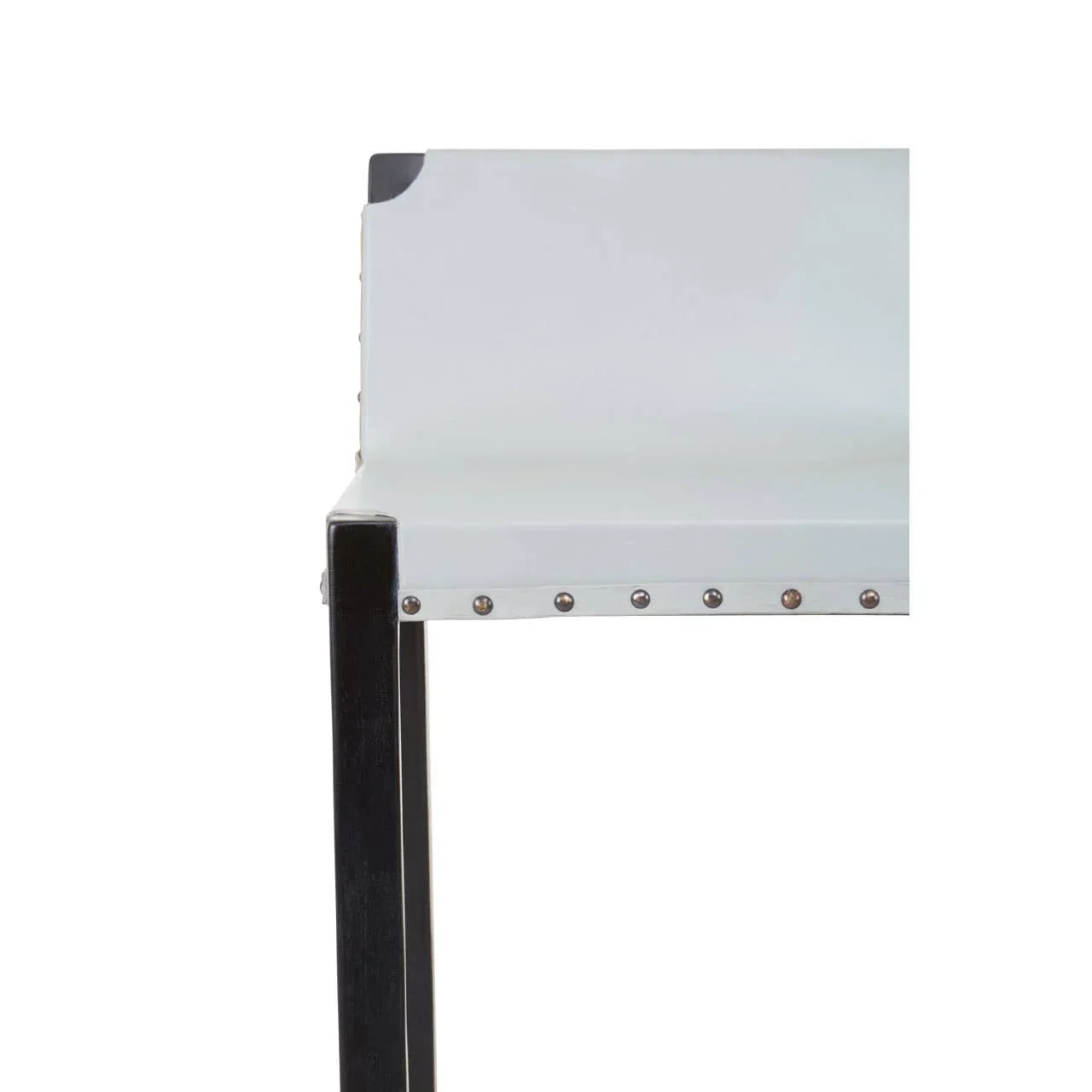 White dining chair with studded trim and black wooden legs, side angle view
