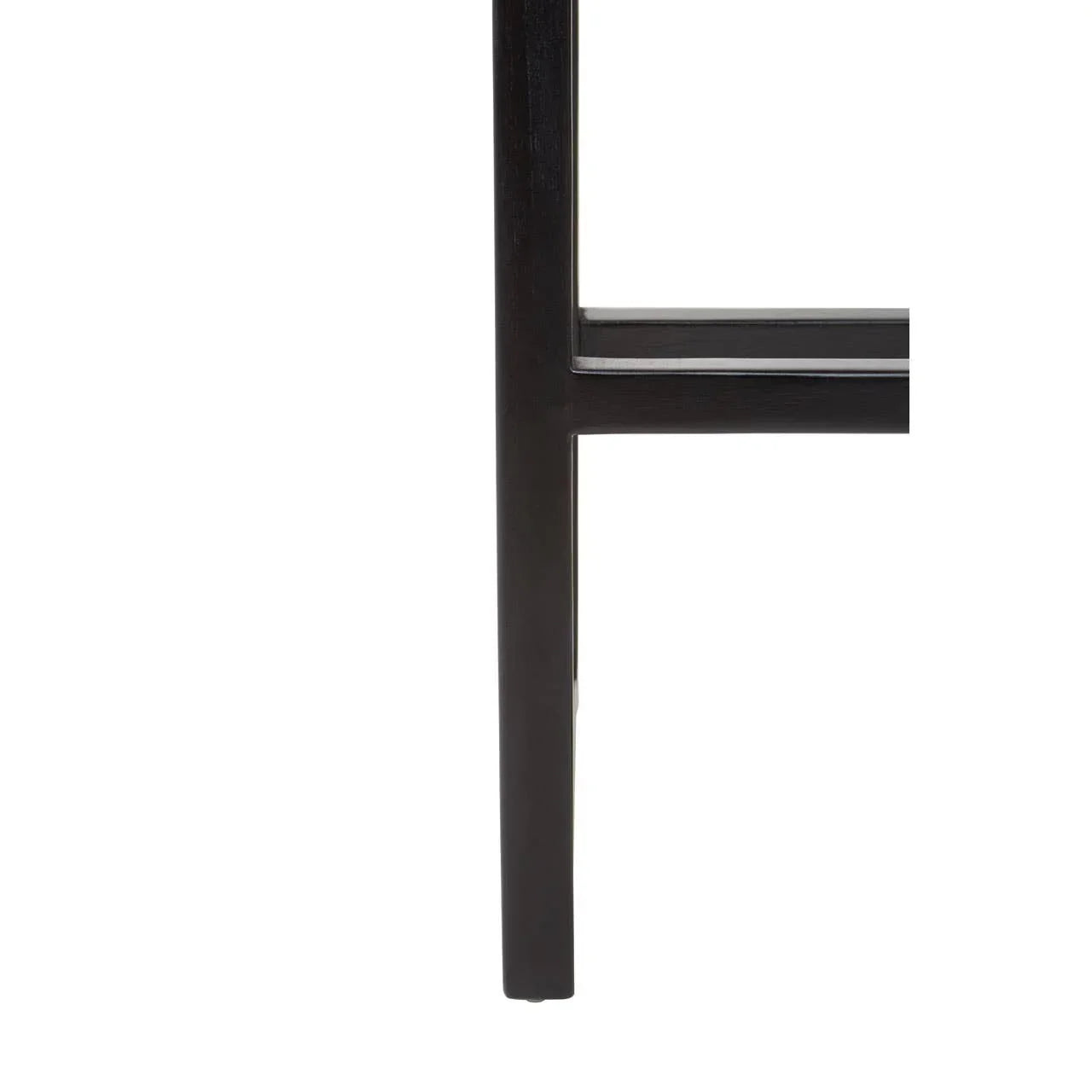 Closeup of dark wood furniture leg with horizontal support bar