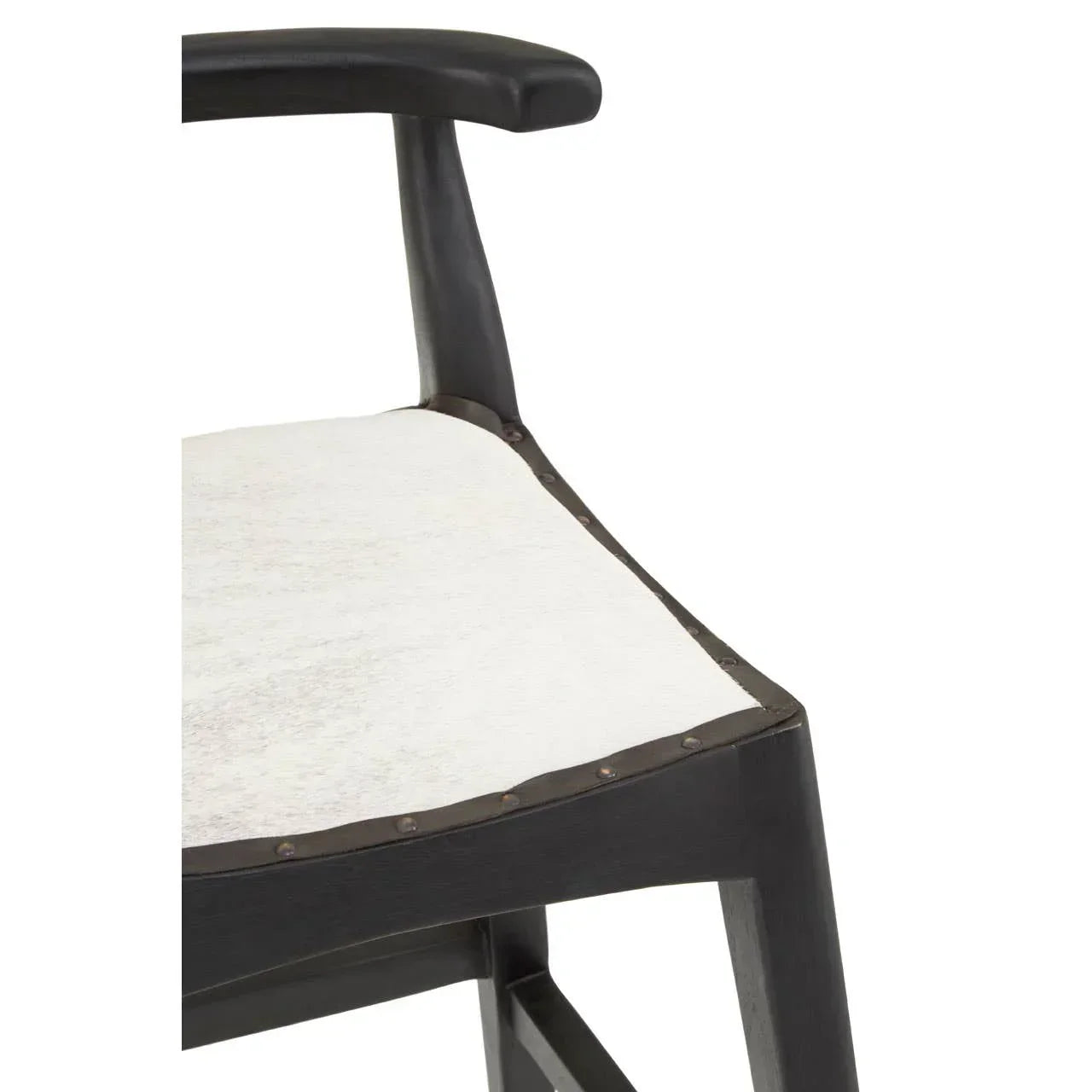 Black wooden armchair with white cowhide upholstered seat and stud detailing