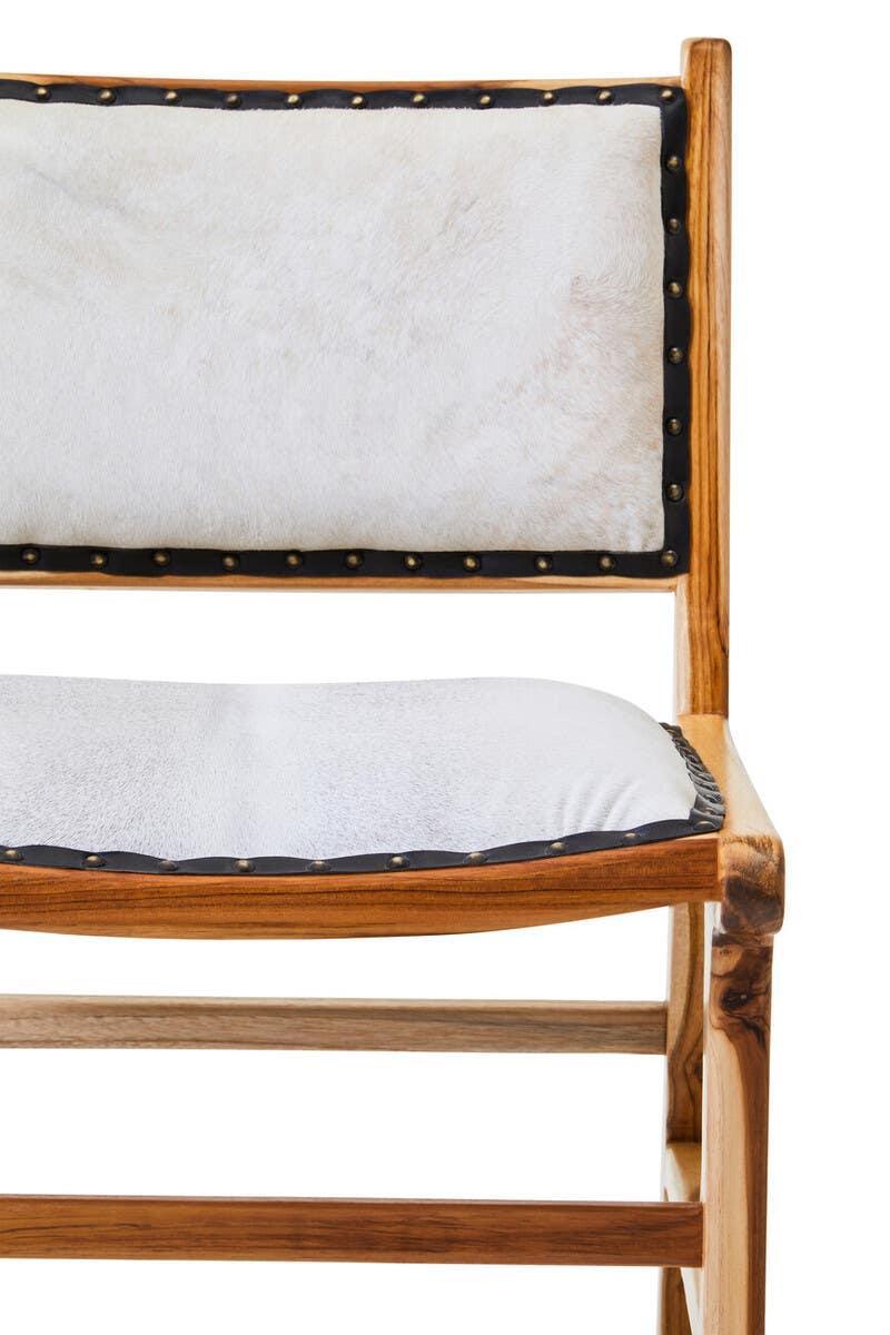 Wooden dining chair with white upholstered seat and back, brass stud detailing