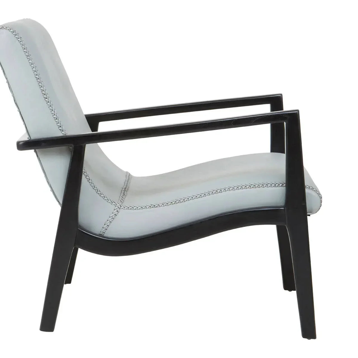 Modern accent chair with light upholstery and black wooden frame, side profile view
