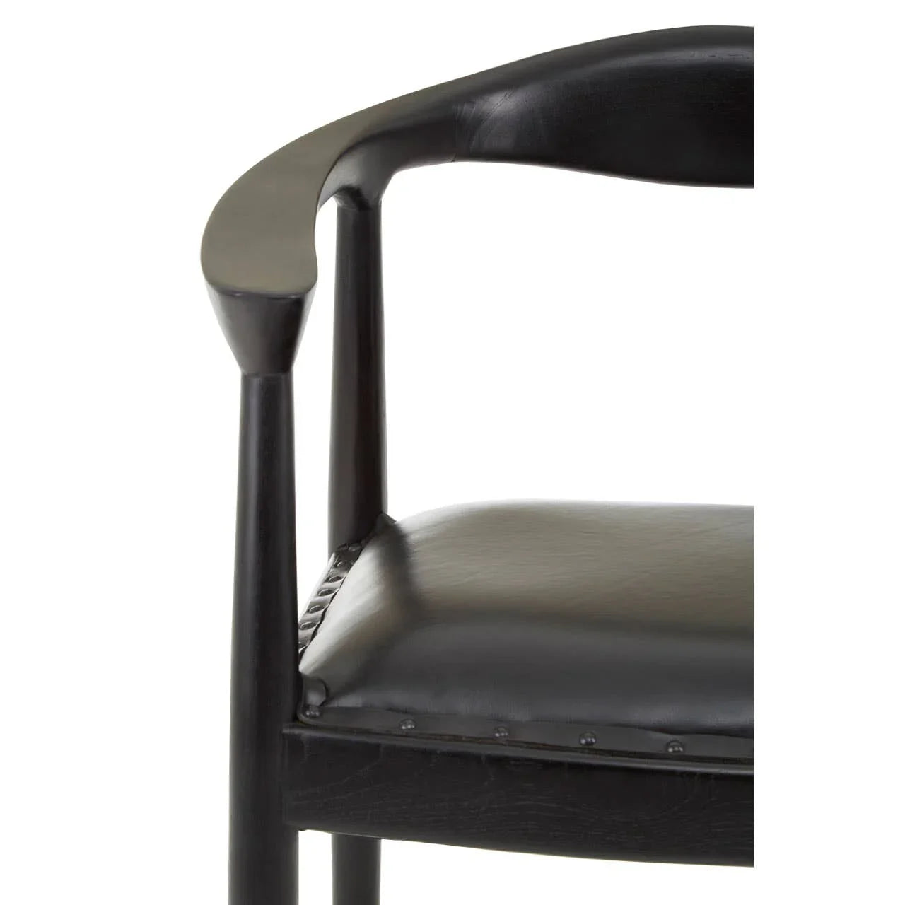 Close-up of black wooden dining chair with curved backrest and padded leather seat