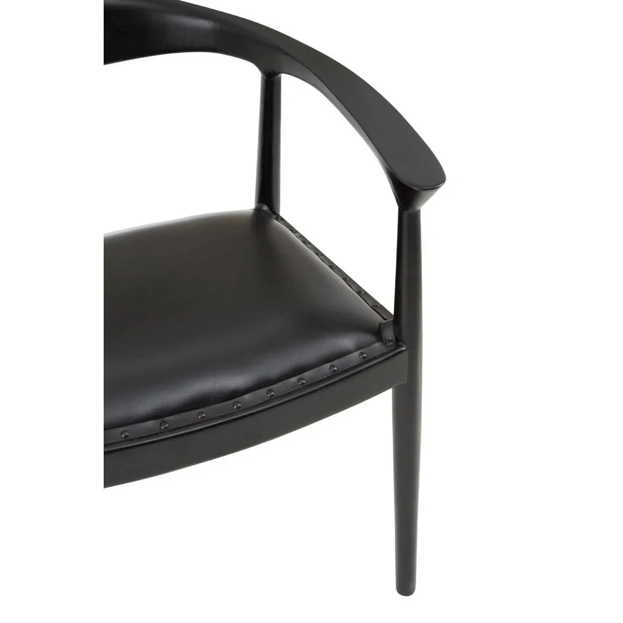 Black leather dining chair with curved armrest and stud detailing, partial side view