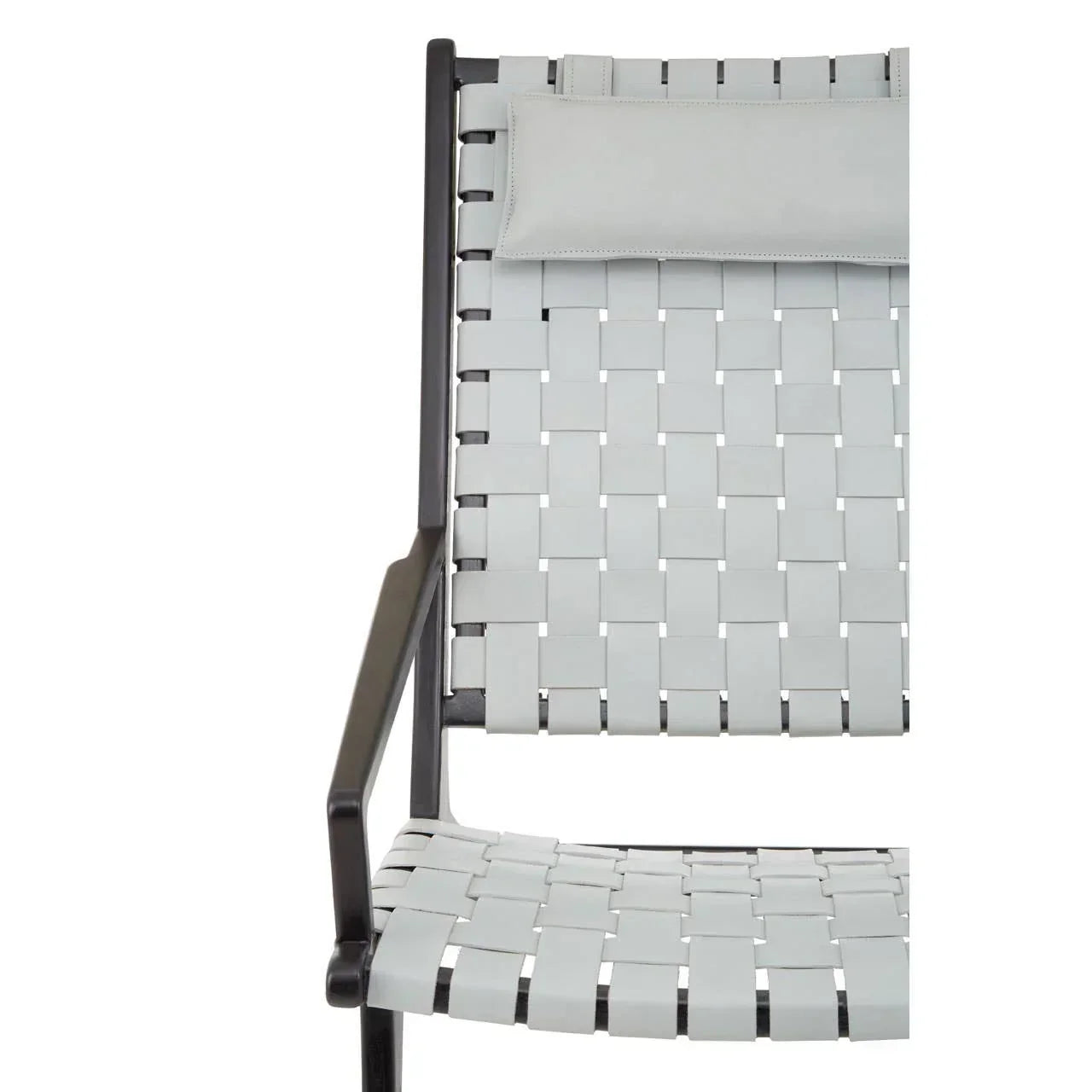 Grey woven strap dining chair with metal frame and padded headrest, side view