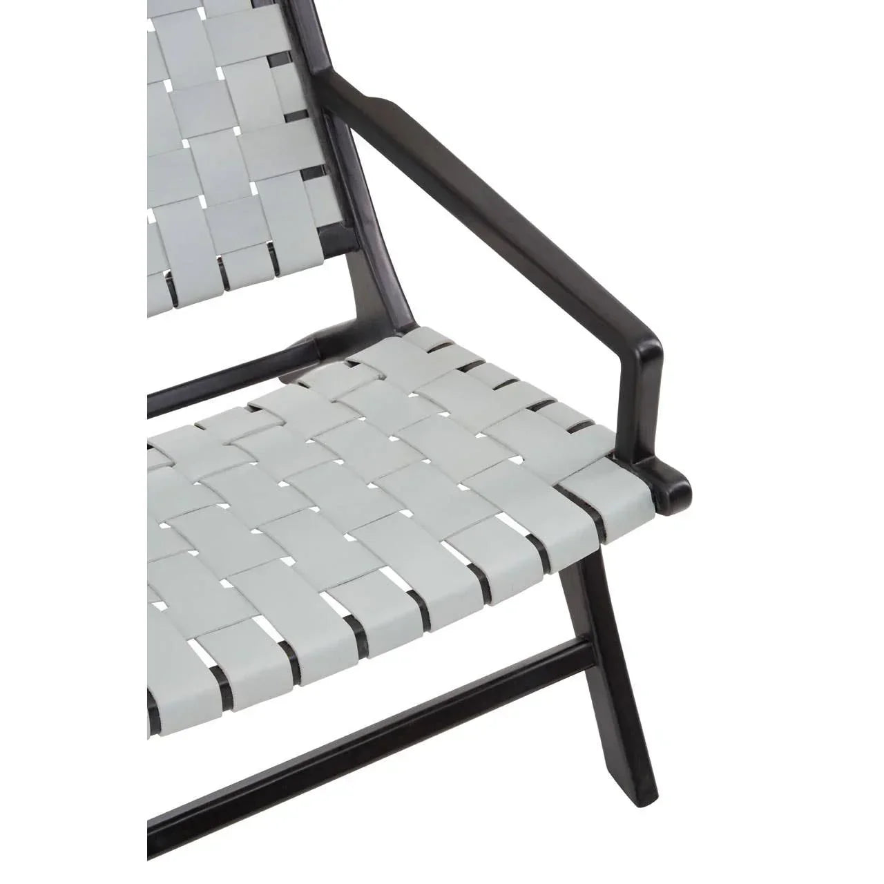 Close-up of woven strap dining chair seat and black metal armrest