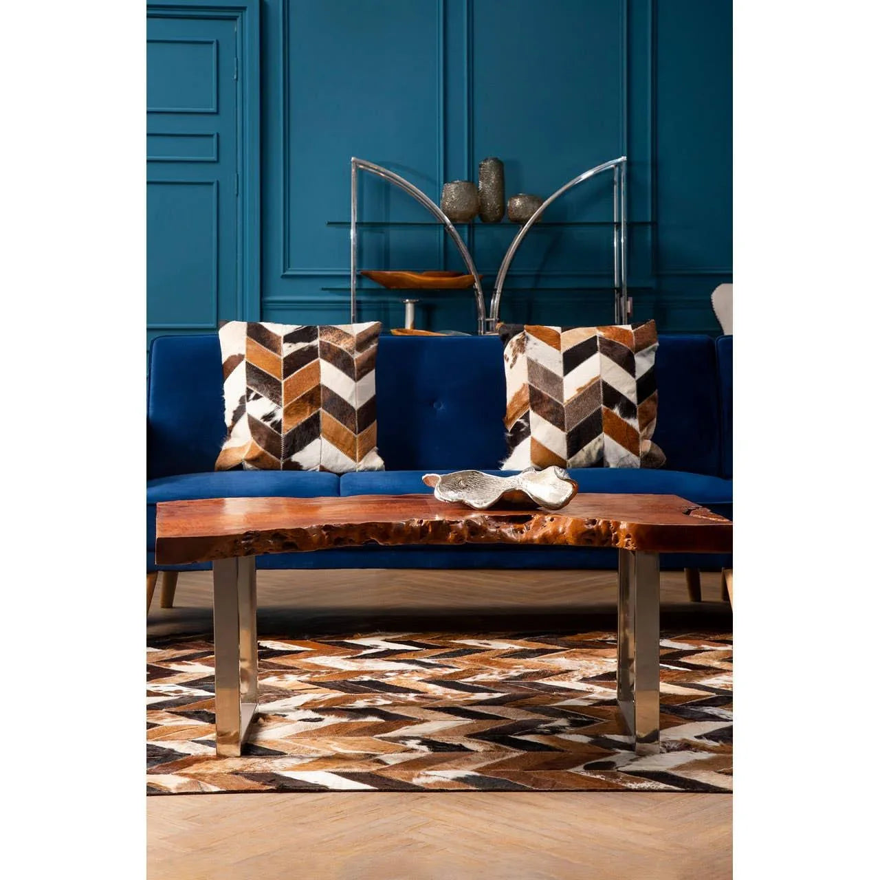Live edge wooden coffee table with metal legs on geometric rug in modern living room