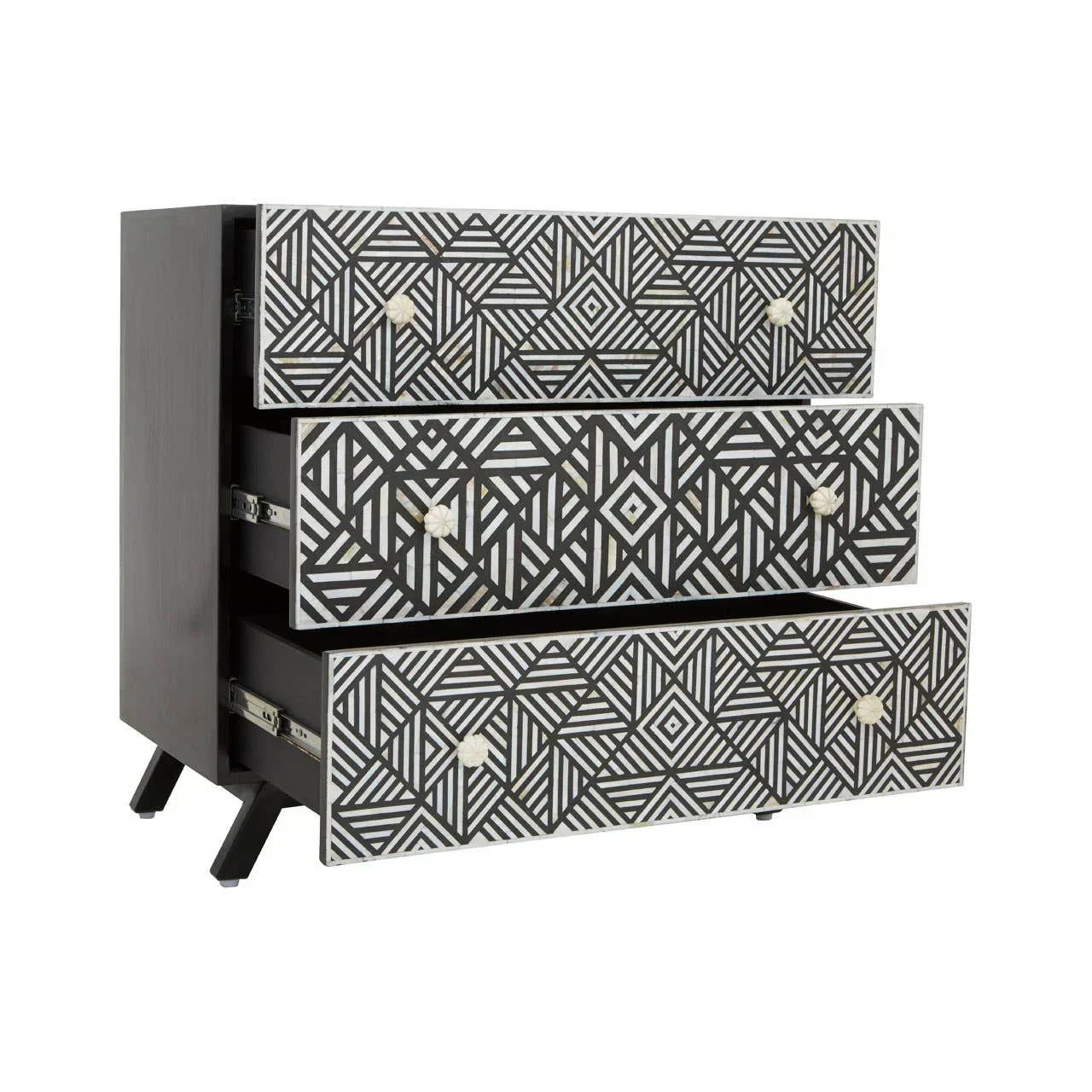 Black and white geometric pattern chest of drawers with three drawers partially open