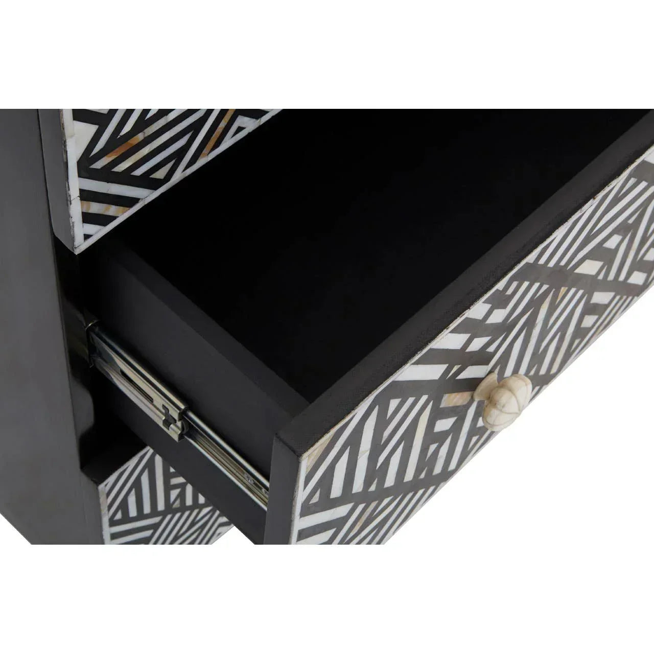 Geometric pattern black and white drawer unit with open drawer and round handle