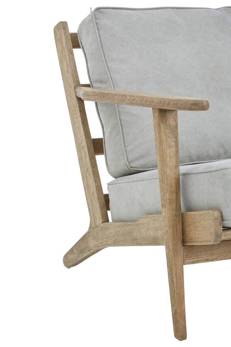 Light wood armchair with grey cushioned seat and backrest, side angle view