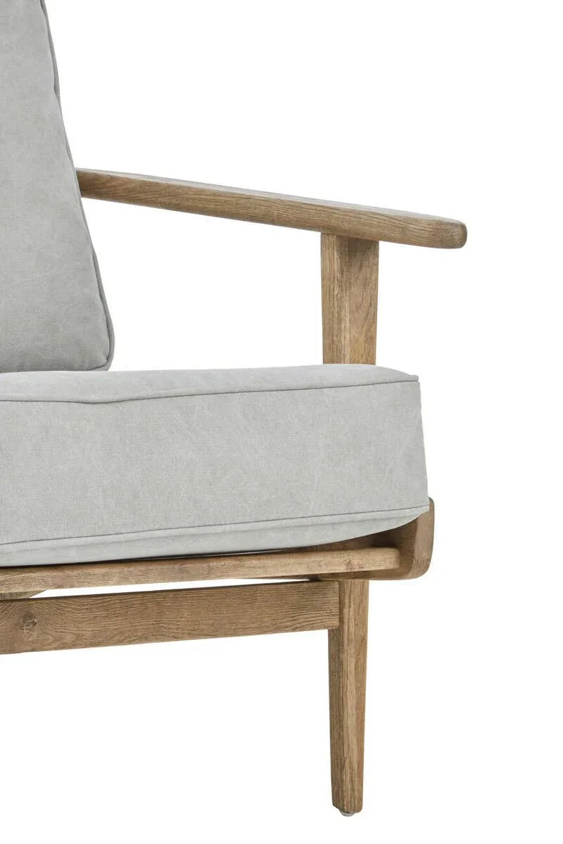 Light grey sofa with wooden frame and armrest, close-up of seat cushion and leg
