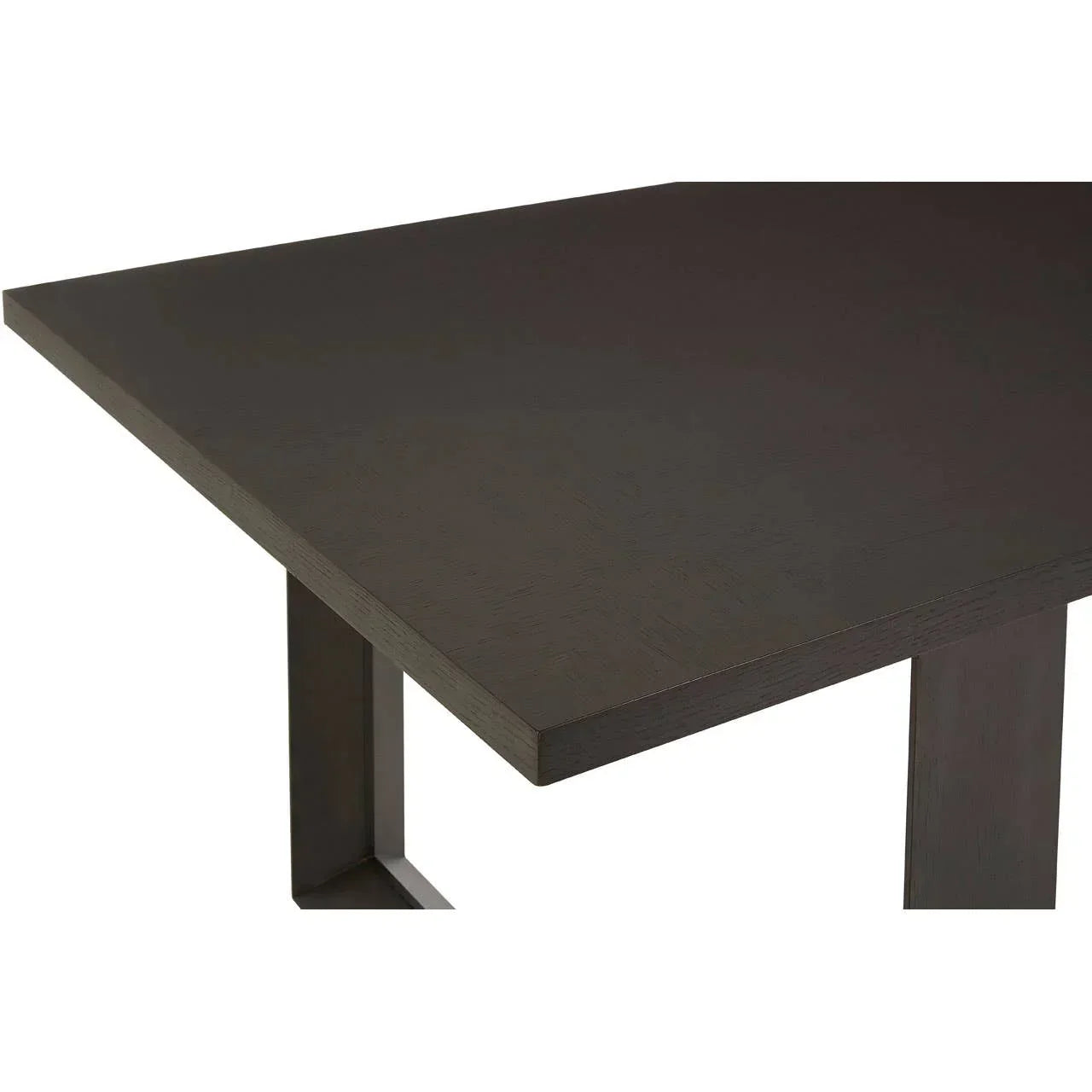 Dark wood dining table corner with sleek rectangular legs and smooth finish