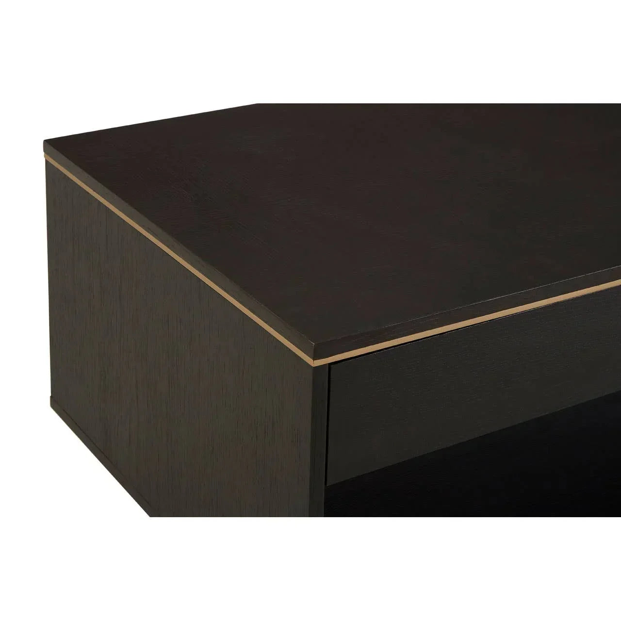 Close-up of dark wood coffee table corner with gold trim detailing