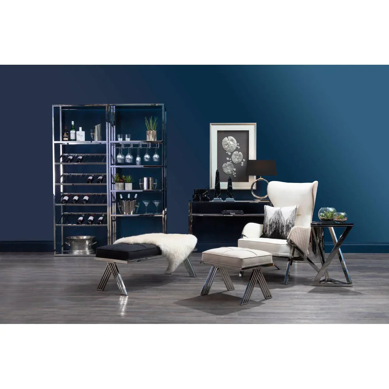 Modern living room with chrome wine rack, white armchair, matching stool, and glass side table
