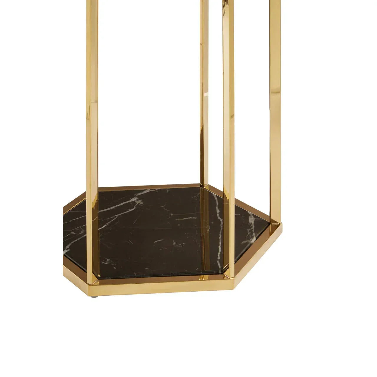 Gold metal side table with black marble hexagonal base, close-up view