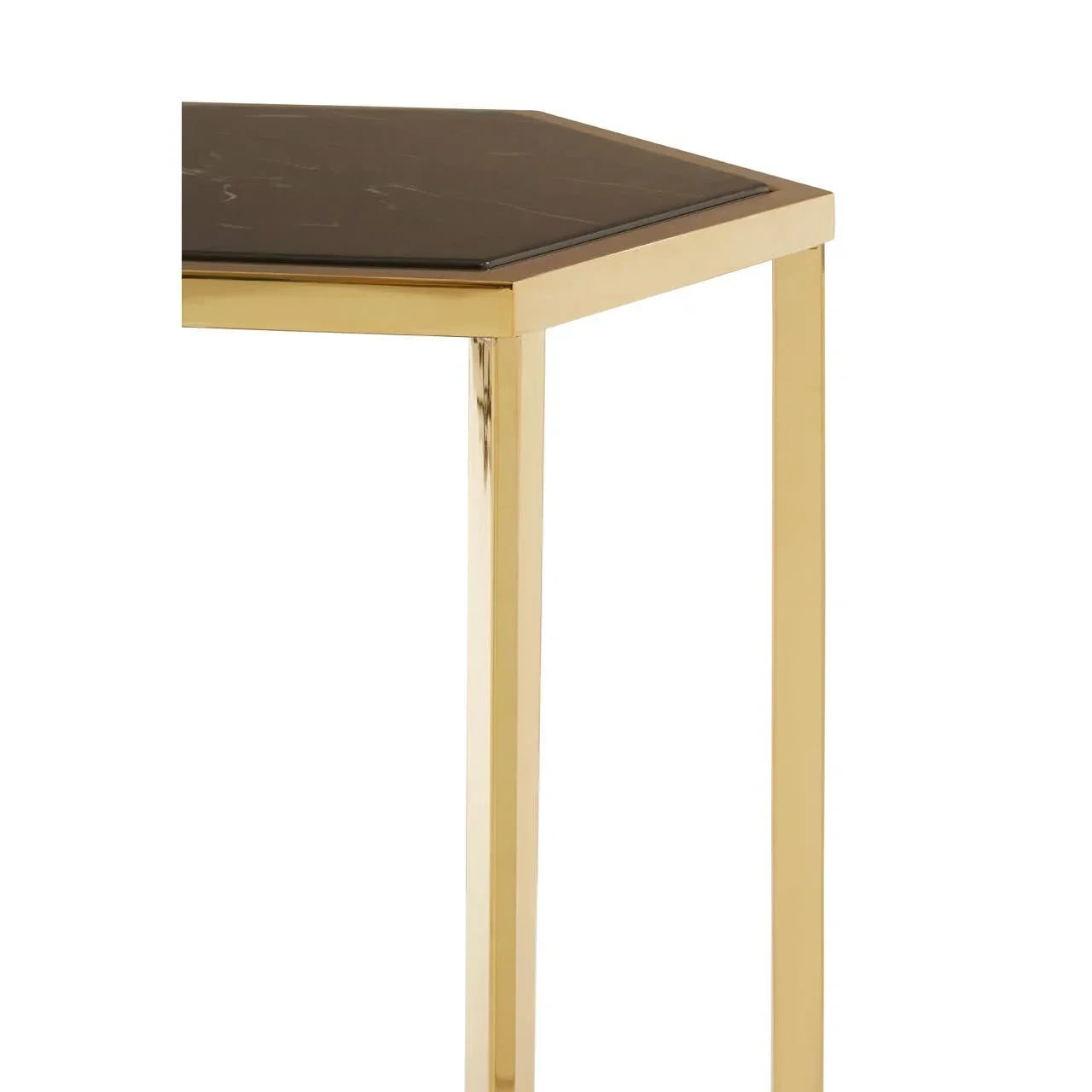 Gold metal side table with black marble hexagonal top, close-up of corner and leg