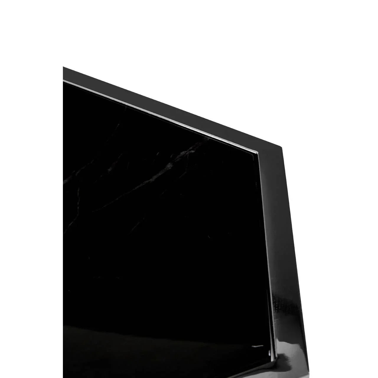 Close-up of black marble table top with polished edges