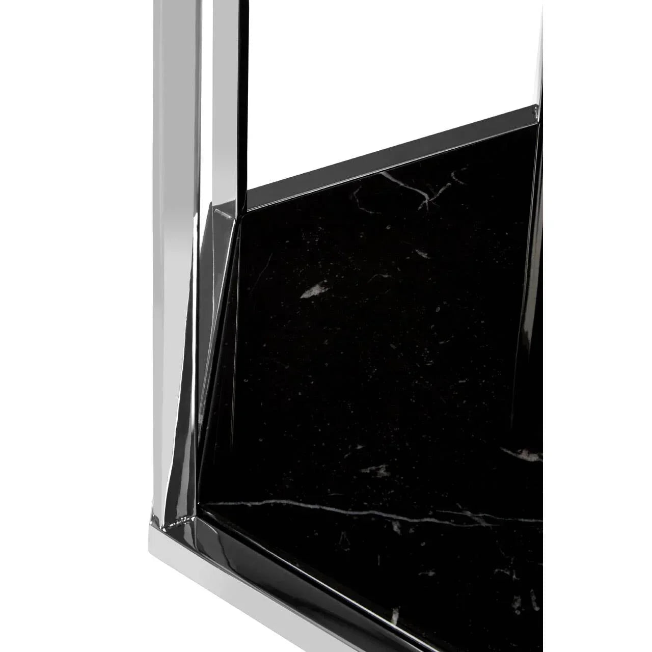 Close-up of black marble table top with chrome metal frame