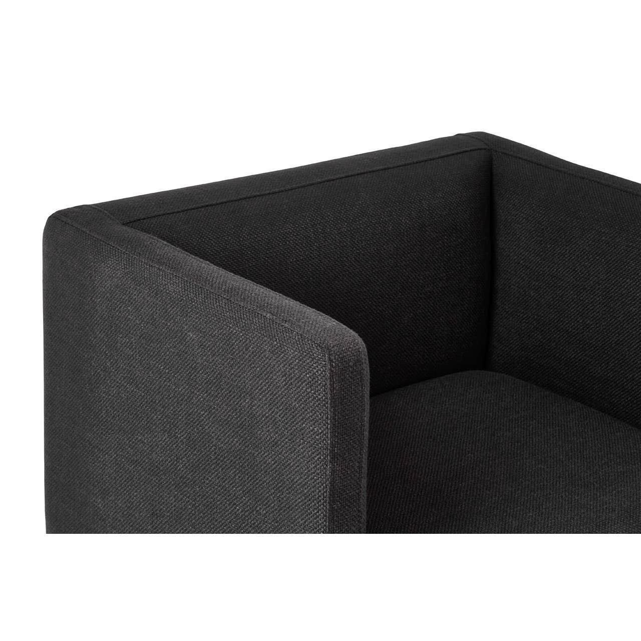 Close-up of charcoal fabric sofa armrest and backrest with textured weave