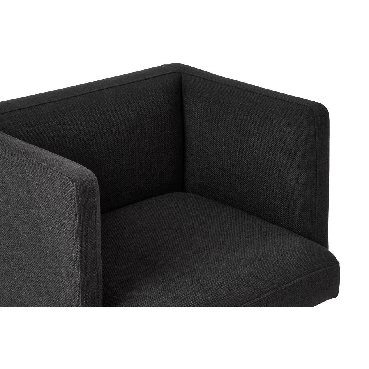 Corner view of black fabric sofa armrest and cushion