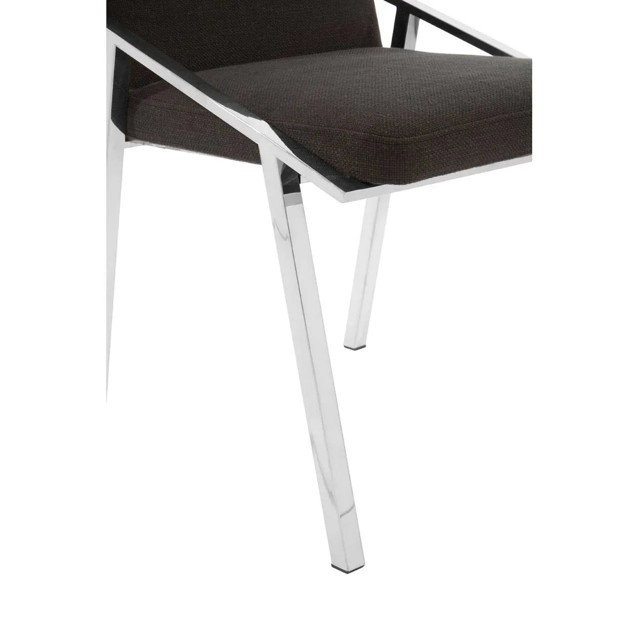 Chrome dining chair leg and black upholstered seat closeup