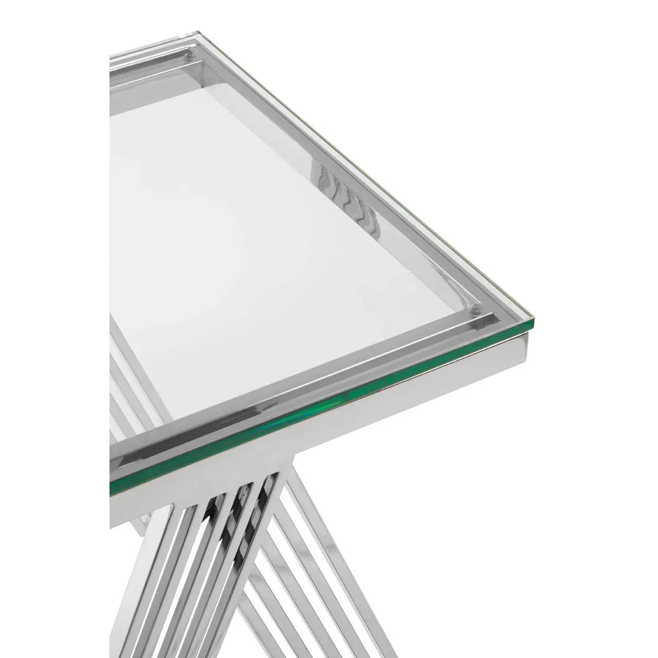 Glass top console table with chrome metal frame and geometric leg design, close-up view